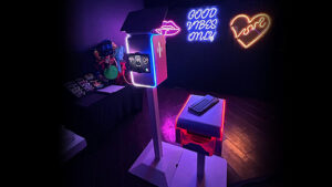 custom neon sign backdrop with our white venture photo booth in Naples, florida